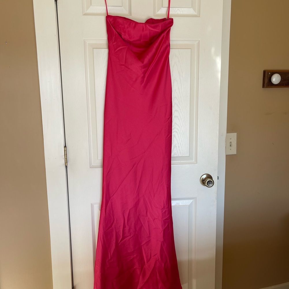 Elegant Pink Strapless dress with very cute back. Color is fruit punch and stu!